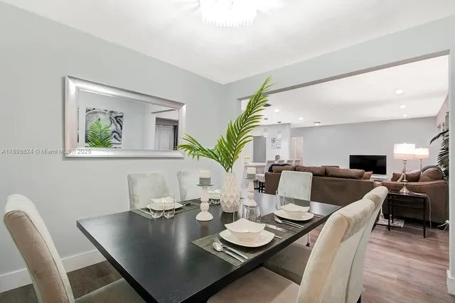 a bedroom with two beds and painting on the wall