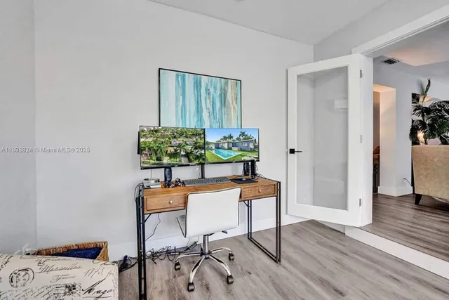 a bedroom with a bed and a lamp