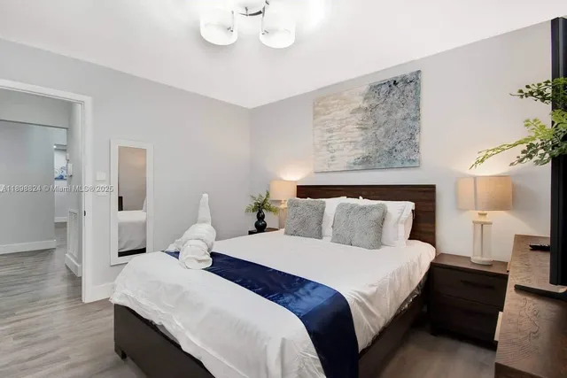 a view of a house with pool and sitting area