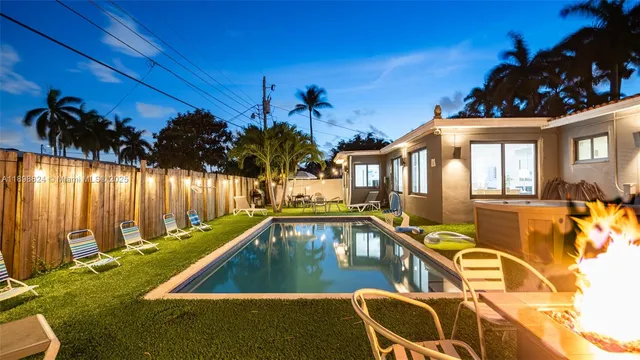 an aerial view of residential house with outdoor space and parking
