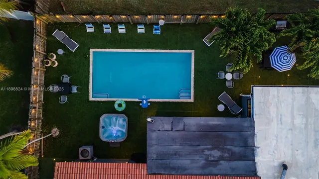 a backyard of a house with table and chairs