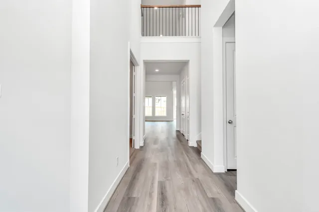 an aerial view of a house with a swimming pool