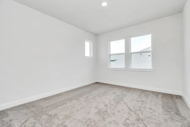 a view of an empty room with closet