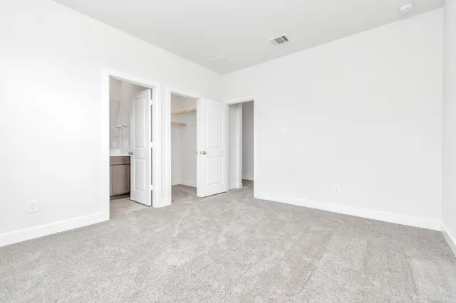 a view of a living room with furniture and a rug
