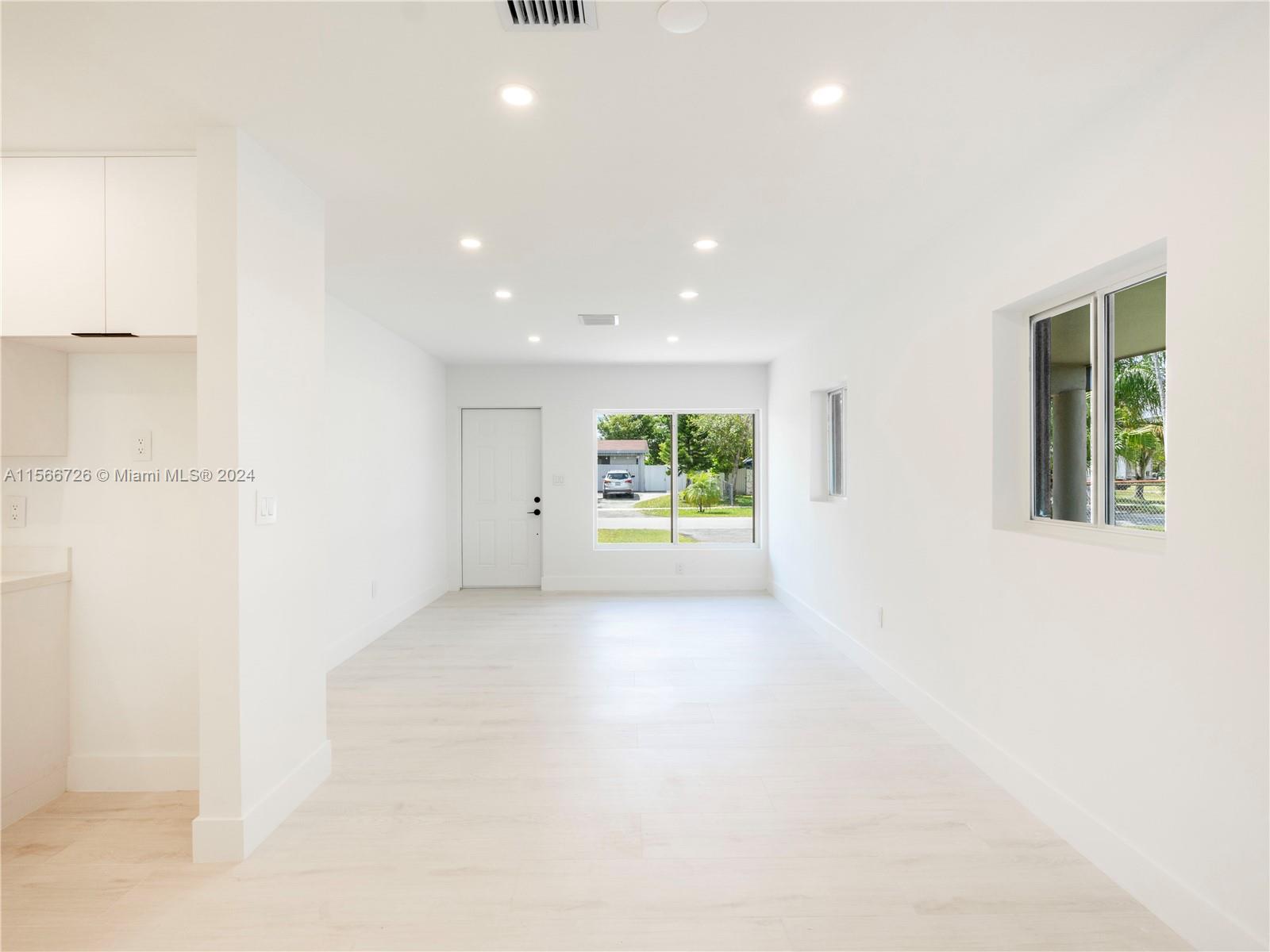 11561 Southwest 187th Street Miami, FL 33157 - Photo 11 of 35 a view of an empty room with a window