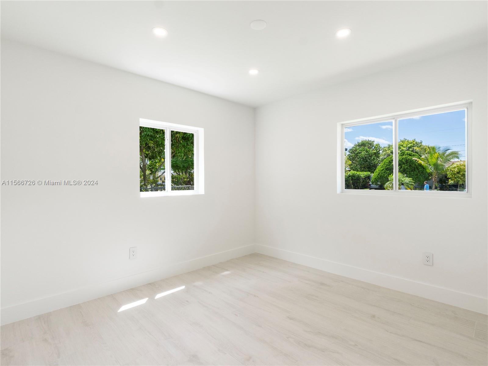 11561 Southwest 187th Street Miami, FL 33157 - Photo 20 of 35 an empty room with windows