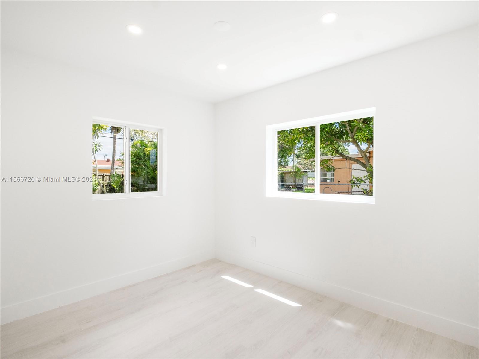 11561 Southwest 187th Street Miami, FL 33157 - Photo 22 of 35 an empty room with a window