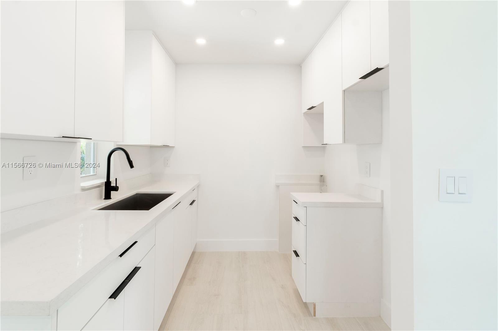 11561 Southwest 187th Street Miami, FL 33157 - Photo 26 of 35 a bathroom with a sink a toilet and mirror