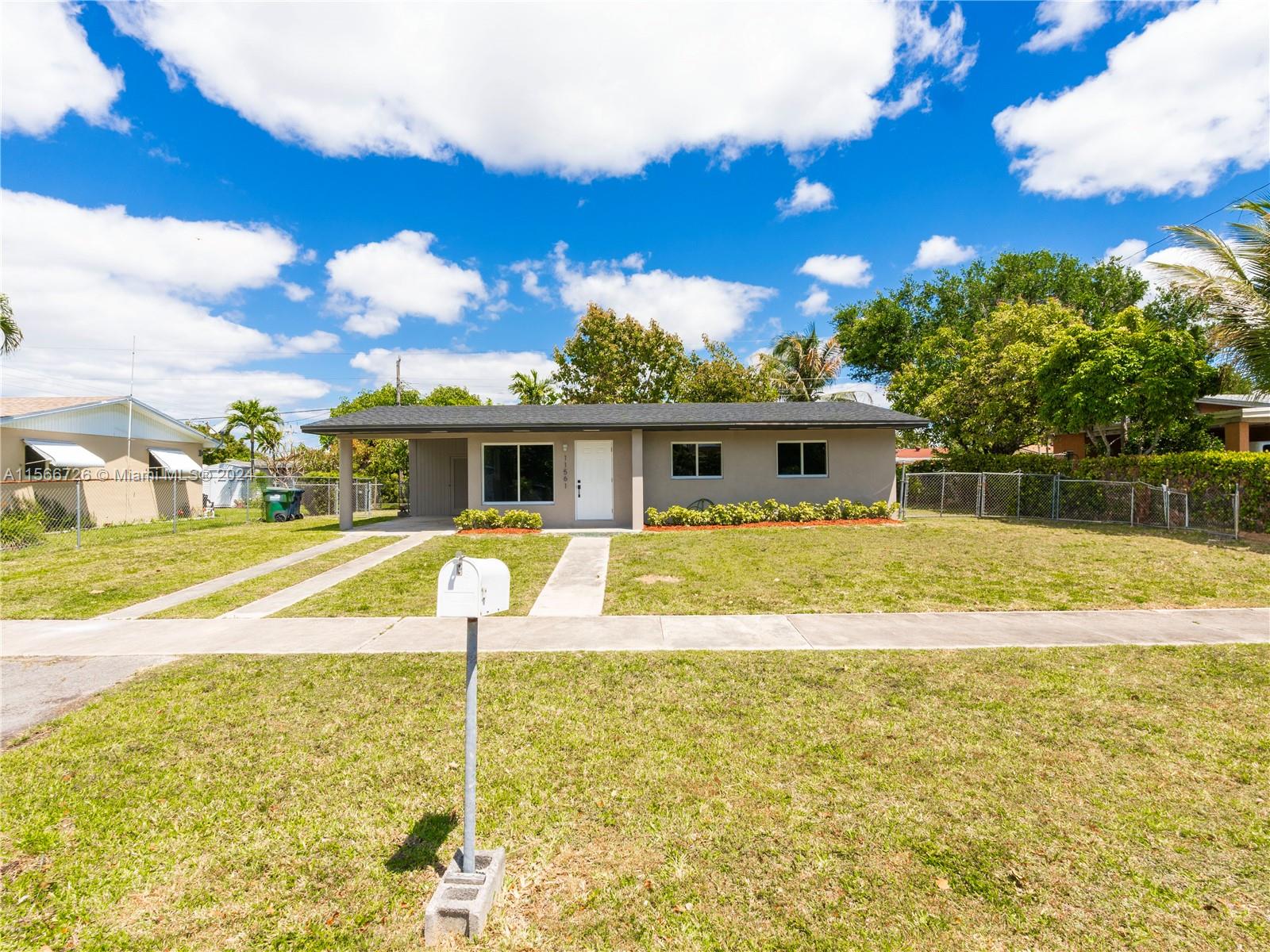 11561 Southwest 187th Street Miami, FL 33157 - Photo 3 of 35 a house view with a swimming pool