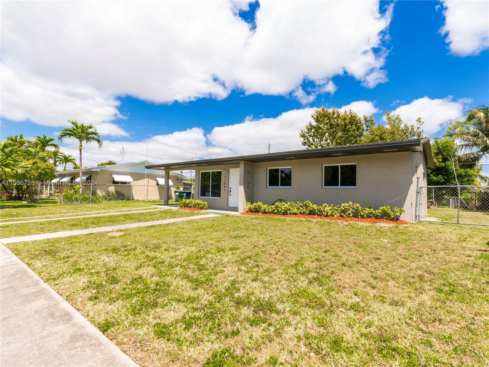 11561 Southwest 187th Street Miami, FL 33157 - Photo 4 of 35 a view of house with outdoor space