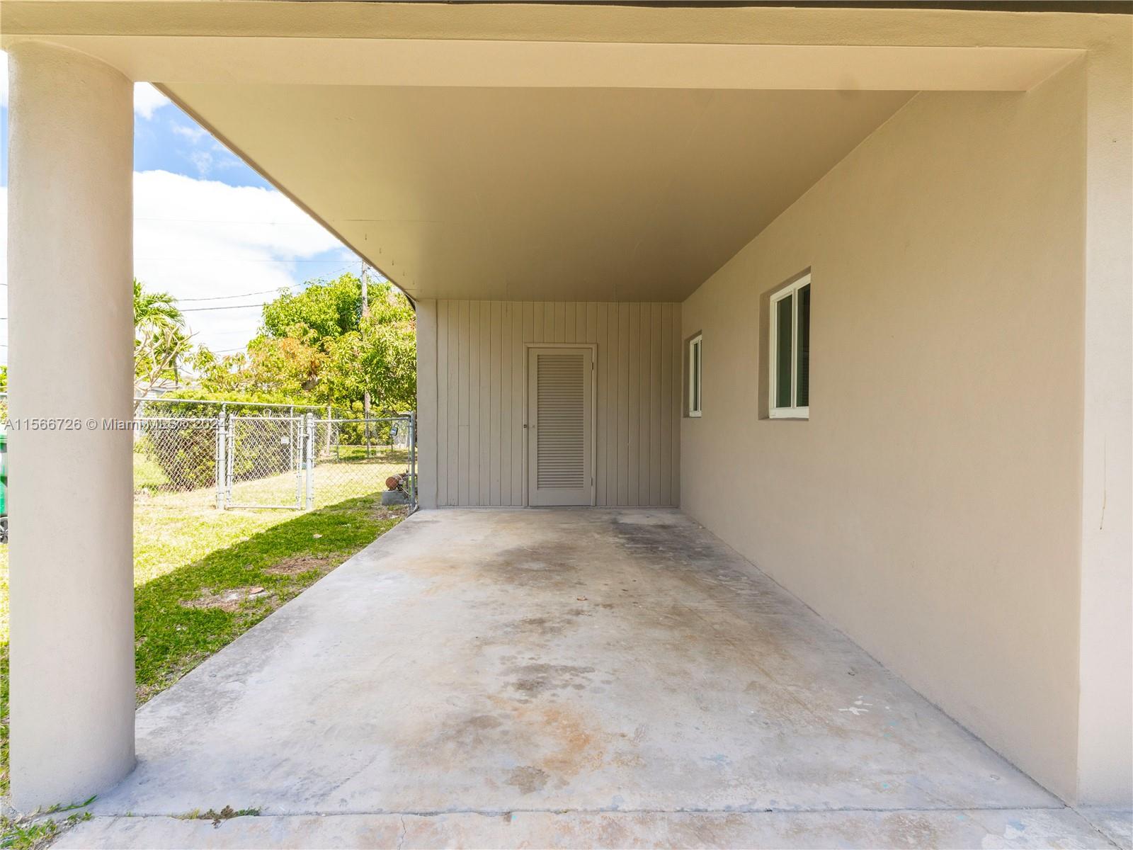 11561 Southwest 187th Street Miami, FL 33157 - Photo 6 of 35 a view of a big room with wooden floor and windows