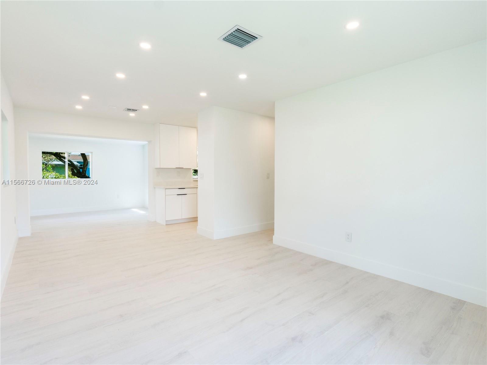 11561 Southwest 187th Street Miami, FL 33157 - Photo 8 of 35 a view of an empty room with a window