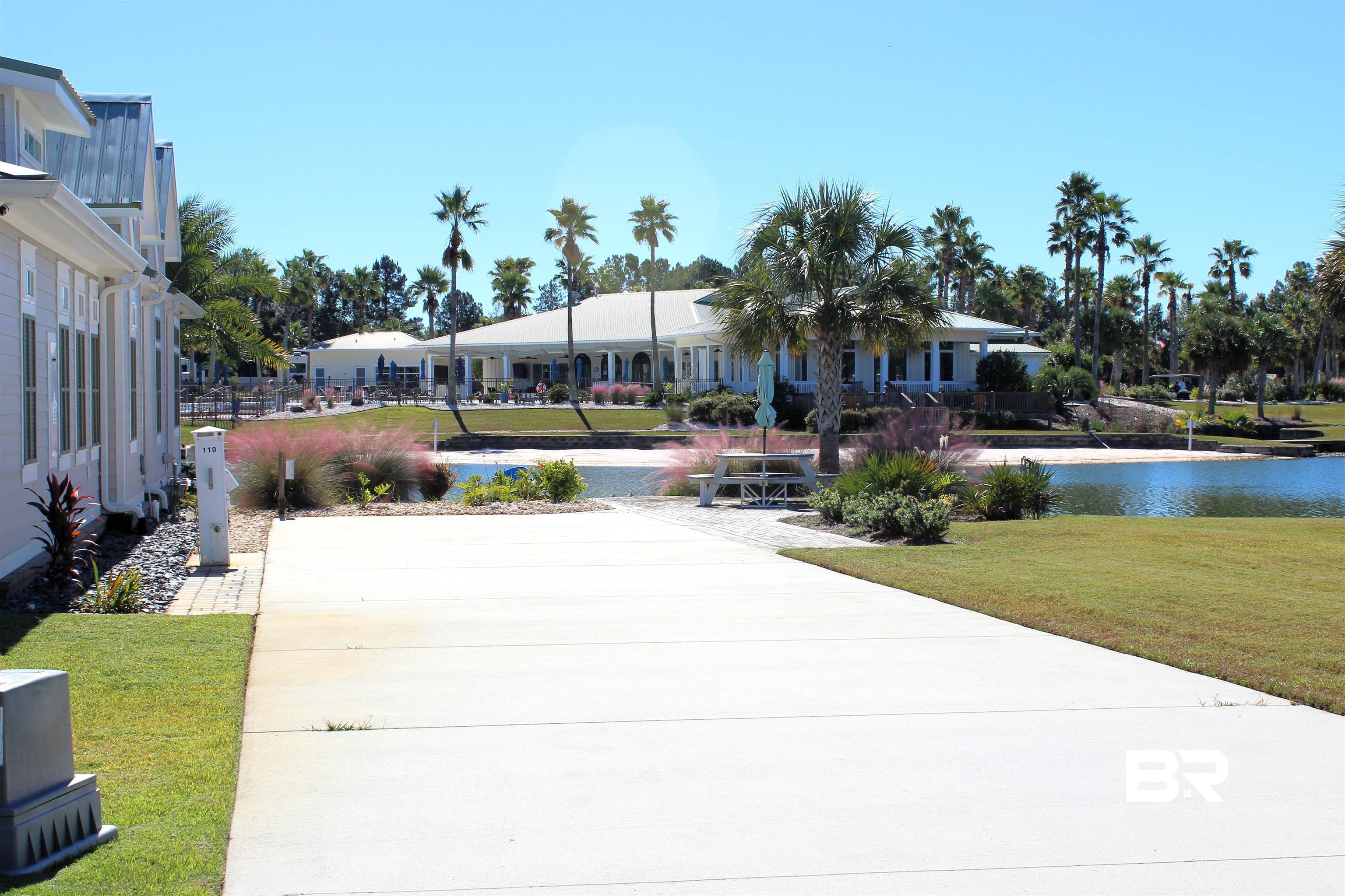 28152 Migratory Way Elberta, AL 36530 - Photo 3 of 54 View of property's community featuring a lawn and a water view