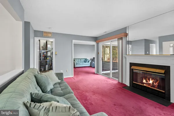 a bedroom with a bed and a fireplace