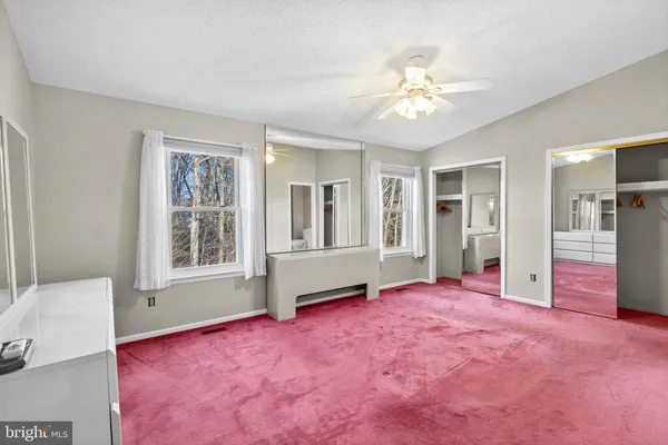 a view of livingroom with hardwood floor and a ceiling fan