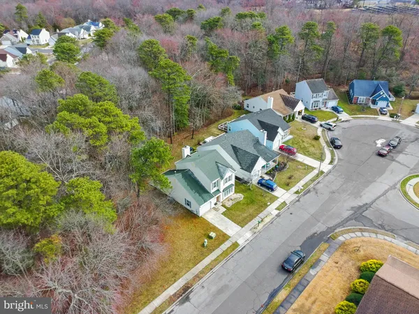 an aerial view of a house with a ocean view