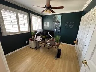 a bathroom with a toilet mirror vanity and a sink
