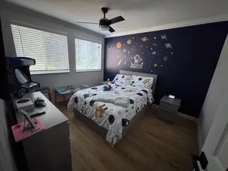 a living room with a couch and a flat screen tv