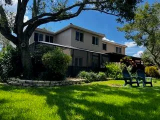 a view of a house with a yard