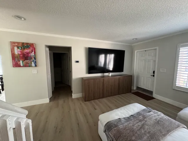 a spacious bedroom with a bed and a couch