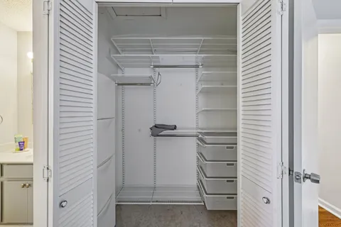 a view of an empty walk in closet