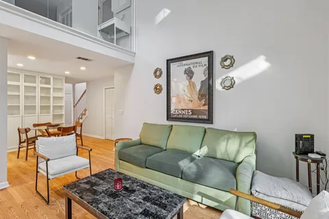 a living room with furniture and a rug