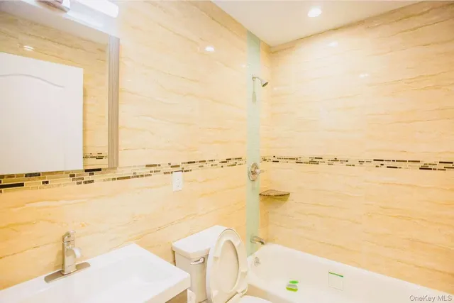 a view of a bathroom and a bath tub