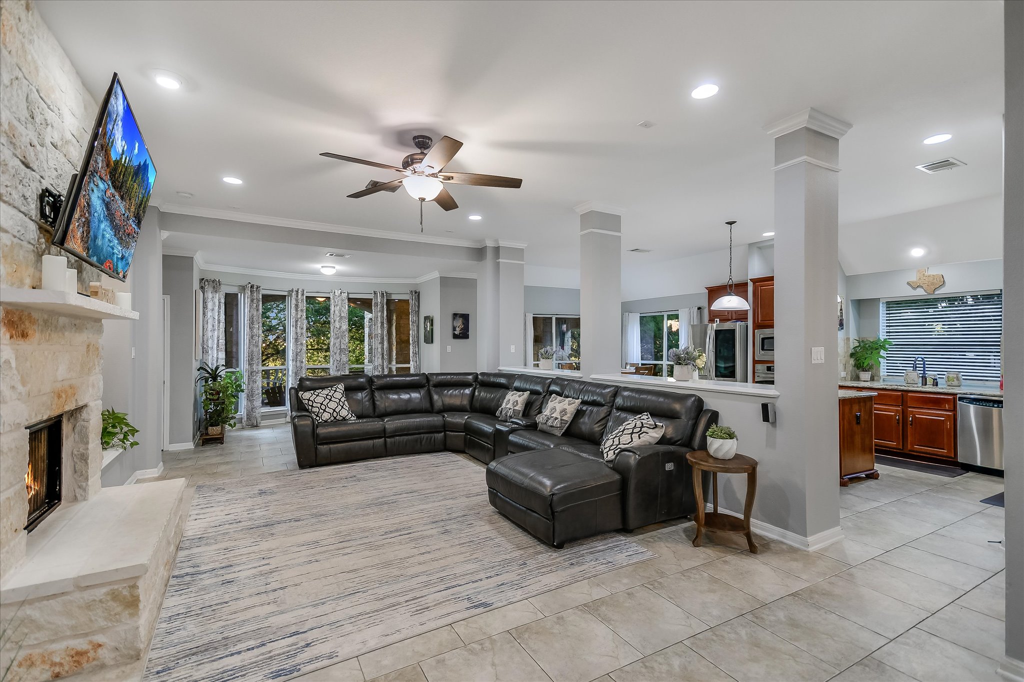 300 Wesley Ridge Drive Spicewood, TX 78669 - Photo 11 of 40 The expansive living area flows effortlessly into the kitchen and dining spaces.