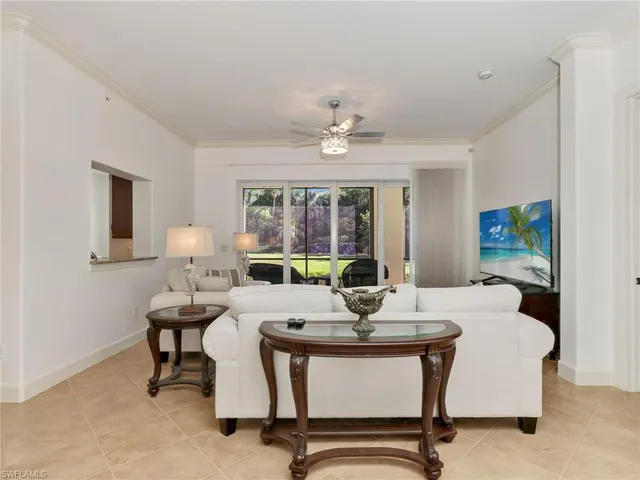 a view of a dining room with a table and chairs