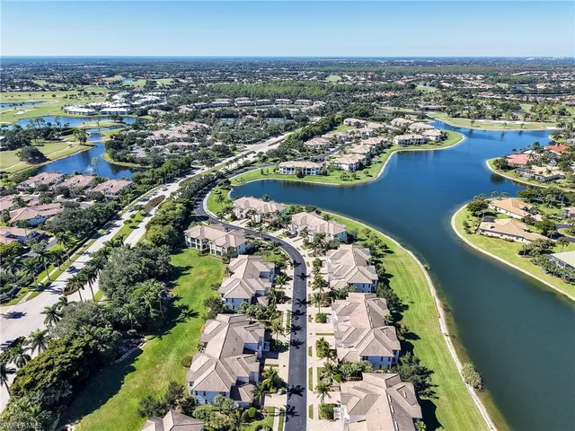 an aerial view of a house with a lake view