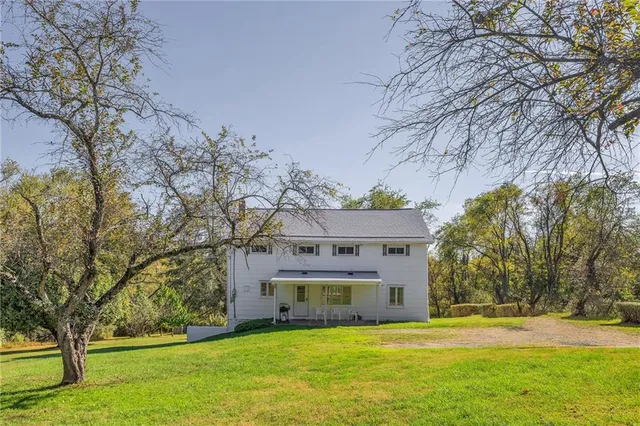 a view of a house with a big yard