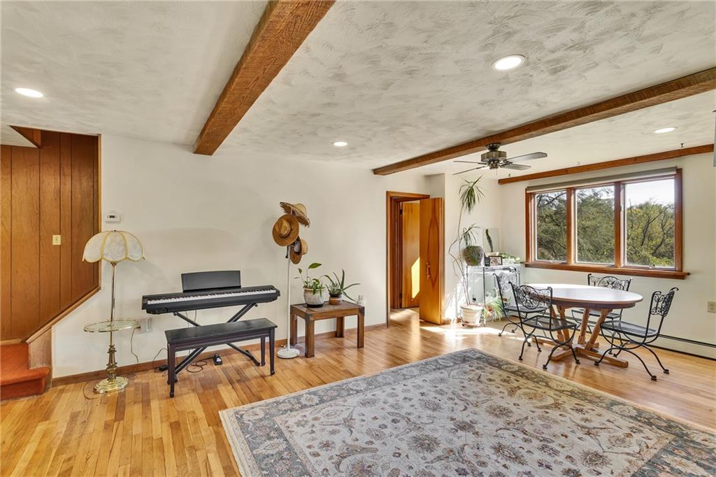 4032 Ewalt Road Gibsonia, PA 15044 - Photo 22 of 40 a living room with furniture a rug and a large window