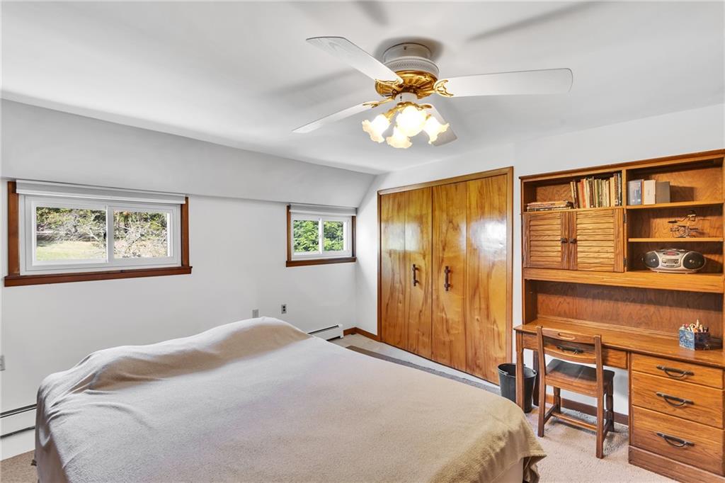 4032 Ewalt Road Gibsonia, PA 15044 - Photo 36 of 40 a bedroom with a bed and a chandelier