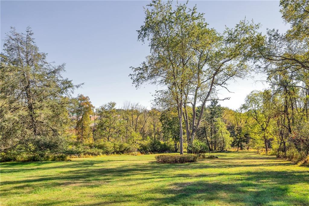 4032 Ewalt Road Gibsonia, PA 15044 - Photo 4 of 40 a view of a grassy field with trees