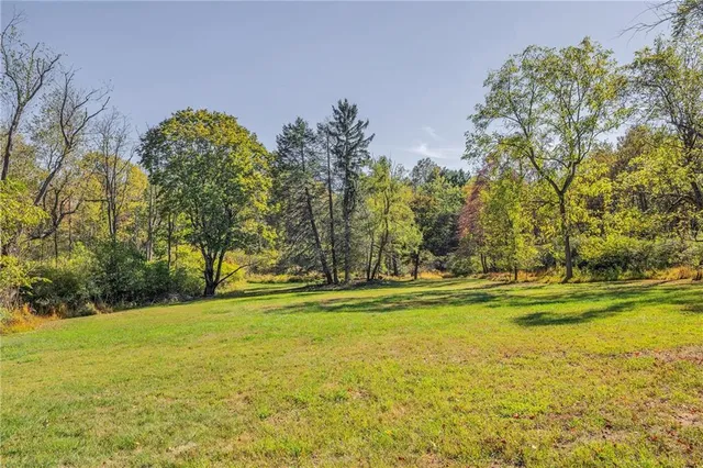 a view of a swimming pool with an outdoor space and seating area
