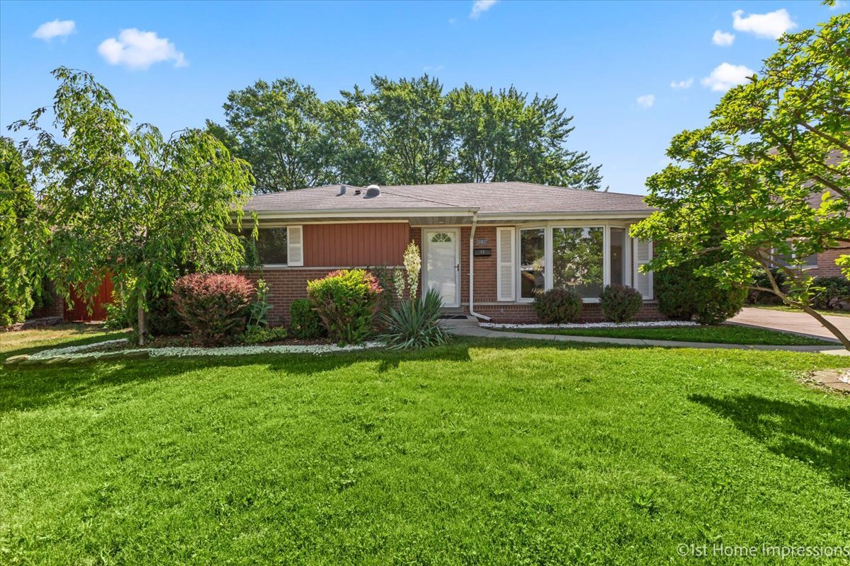 10937 Austin Avenue Chicago Ridge, IL 60415 - Photo 1 of 26 a front view of house with yard and green space