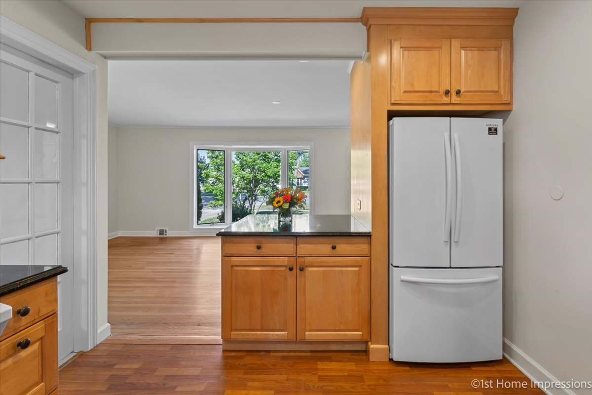 10937 Austin Avenue Chicago Ridge, IL 60415 - Photo 11 of 26 a room with wooden floor and a window