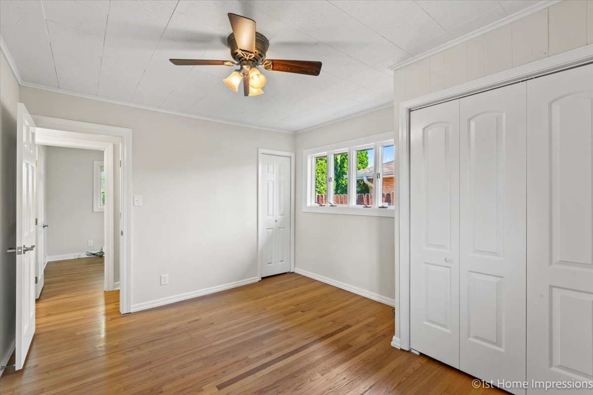 10937 Austin Avenue Chicago Ridge, IL 60415 - Photo 16 of 26 wooden floor in an empty room with a window