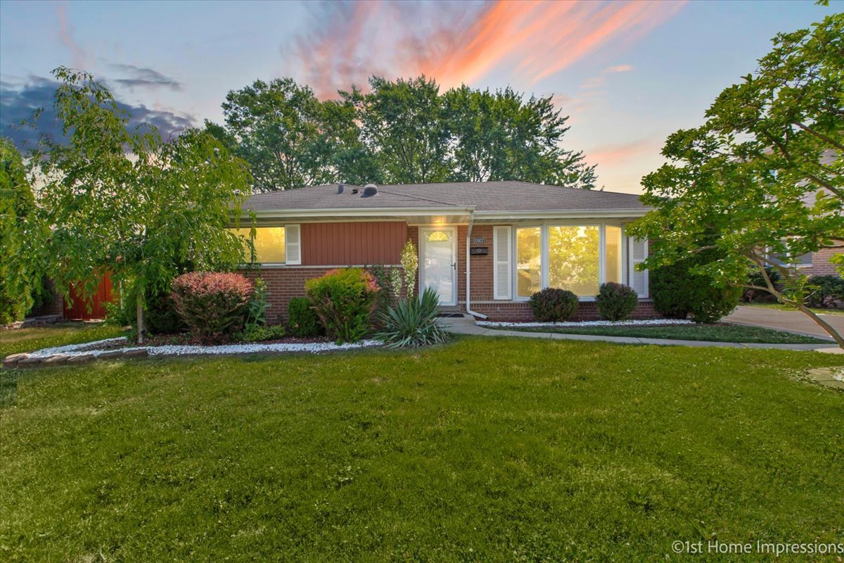 10937 Austin Avenue Chicago Ridge, IL 60415 - Photo 2 of 26 a front view of house with yard and green space