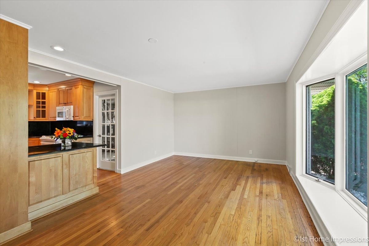 10937 Austin Avenue Chicago Ridge, IL 60415 - Photo 4 of 26 a view of a kitchen with wooden floor electronic appliances and windows