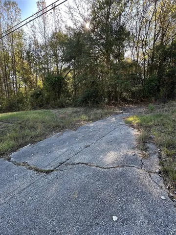 a view of outdoor space with trees all around