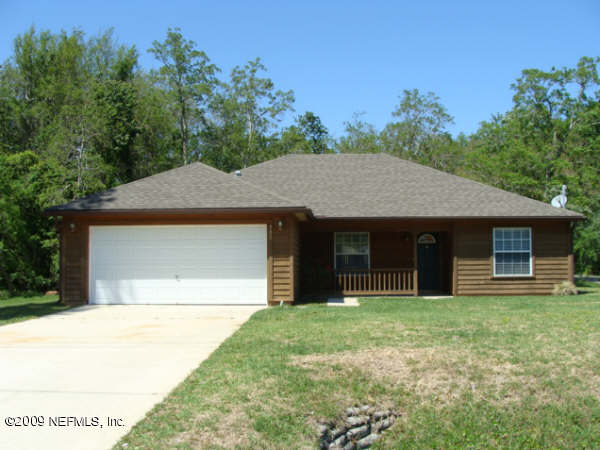 205 Martin Road St. Augustine, FL 32086 - Photo 1 of 1 a house with yard in front of it