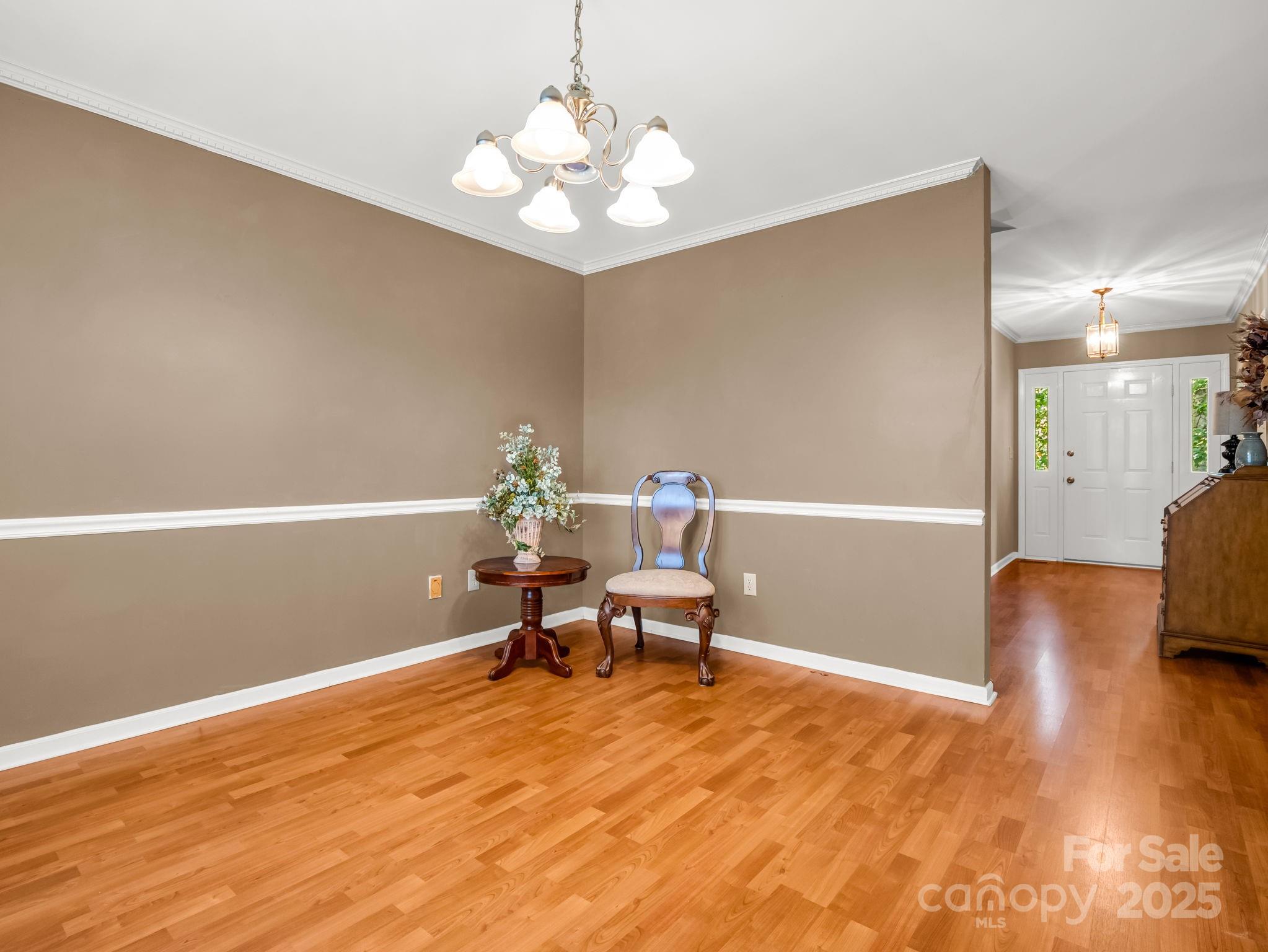 130 Briarwood Drive Rutherfordton, NC 28139 - Photo 13 of 48 a living room with furniture and a chandelier