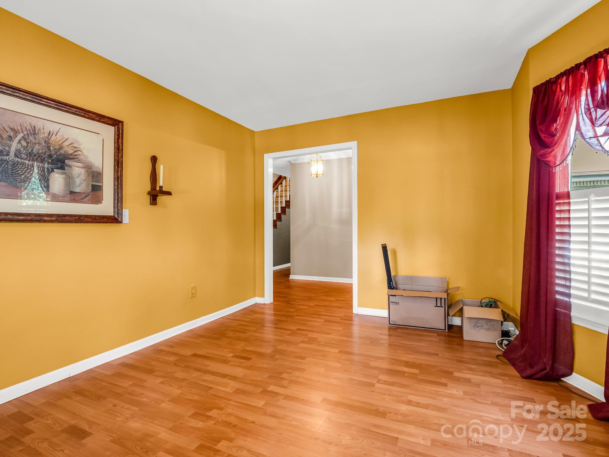 130 Briarwood Drive Rutherfordton, NC 28139 - Photo 15 of 48 a view of an empty room with wooden floor and a window