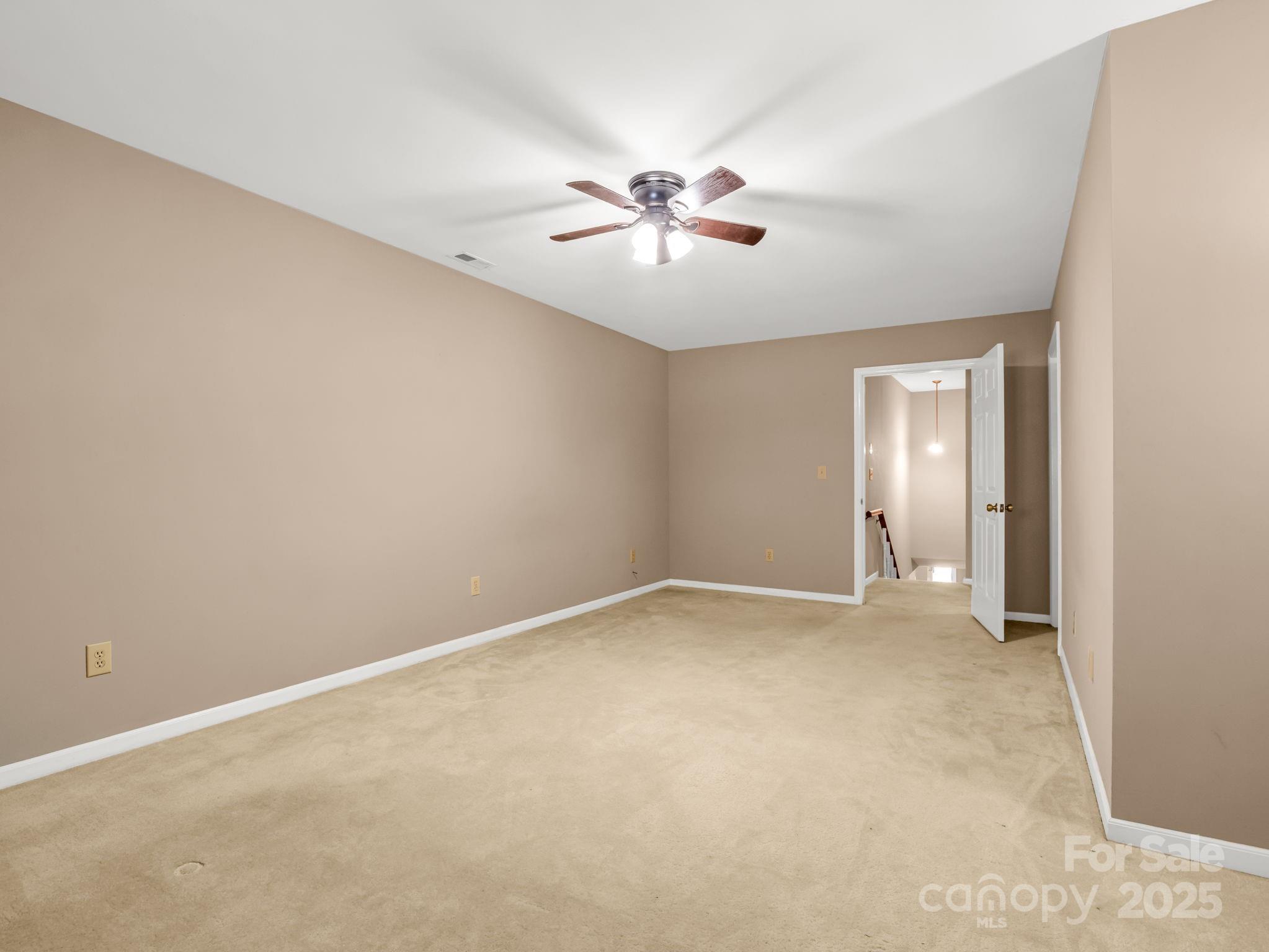 130 Briarwood Drive Rutherfordton, NC 28139 - Photo 25 of 48 an empty room with windows and fan