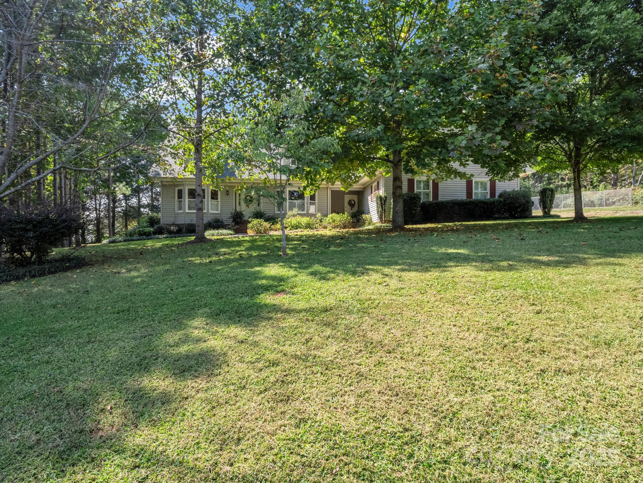 130 Briarwood Drive Rutherfordton, NC 28139 - Photo 41 of 48 a view of a house with a big yard and large trees