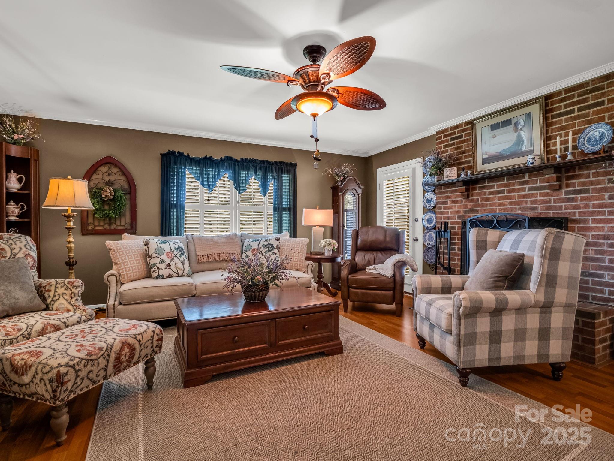 130 Briarwood Drive Rutherfordton, NC 28139 - Photo 6 of 48 a living room with furniture a fireplace and a large window