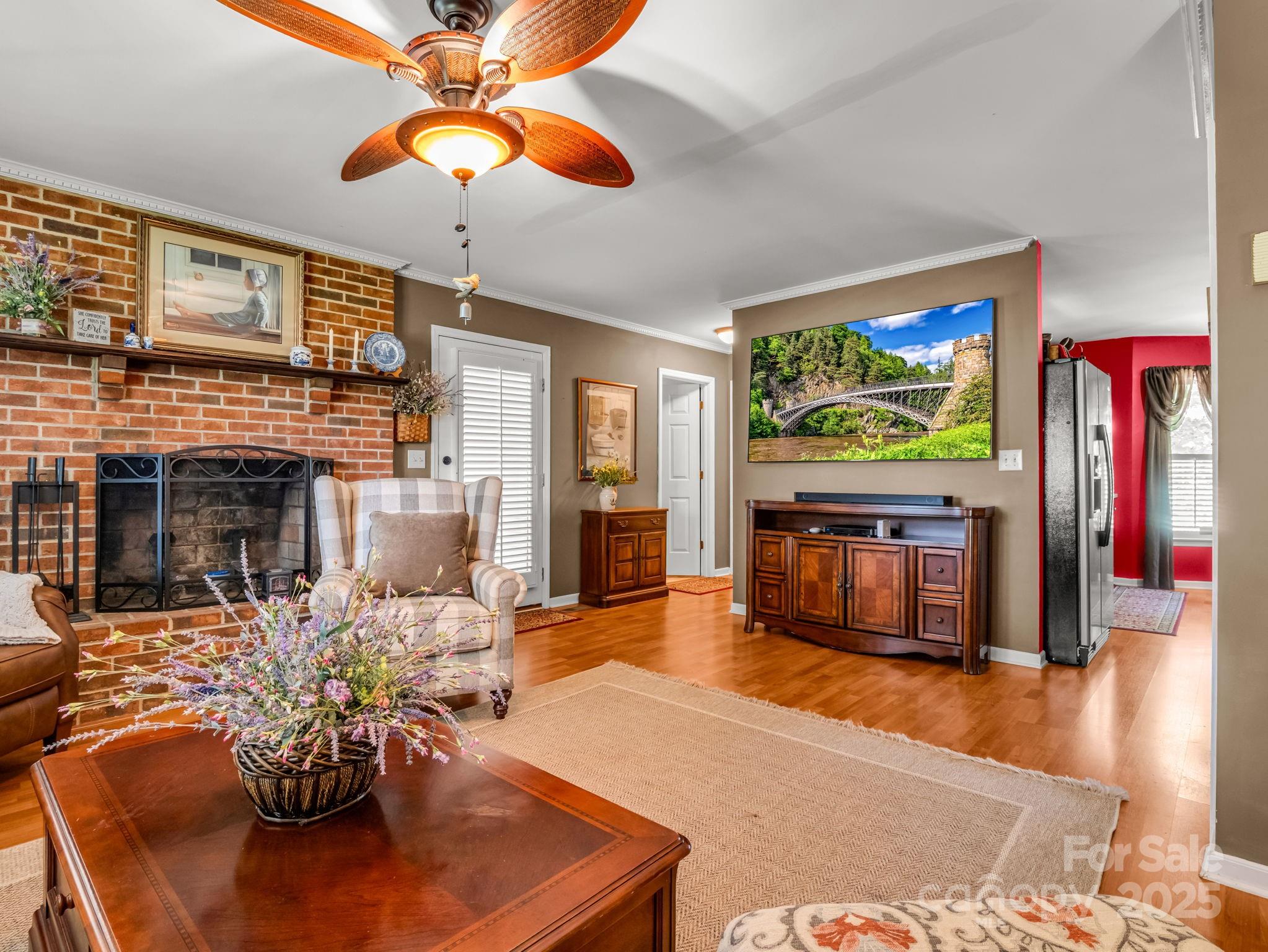 130 Briarwood Drive Rutherfordton, NC 28139 - Photo 7 of 48 a living room with fireplace furniture and a flat screen tv