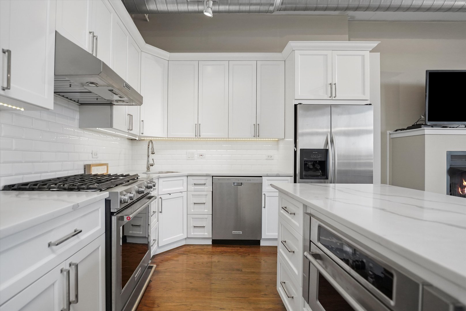 1301 West Madison Street, Unit 629 Chicago, IL 60607 - Photo 4 of 25 a kitchen with a stove oven and sink