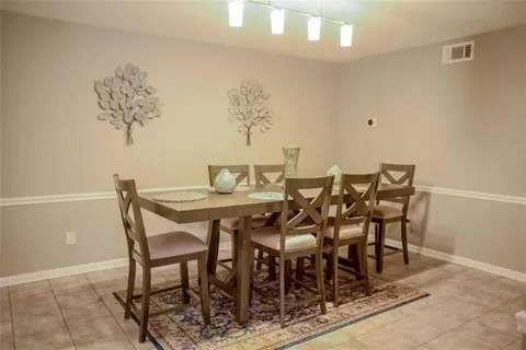 125 Rue Fontaine Lithonia, GA 30038 - Photo 5 of 6 a view of a dining room with furniture